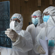 Chinese doctors in Yunmeng county, Xiaogan city, in the coronavirus outbreak epicenter of Hubei province viewing the results of a lung CT scan in a suspected case.